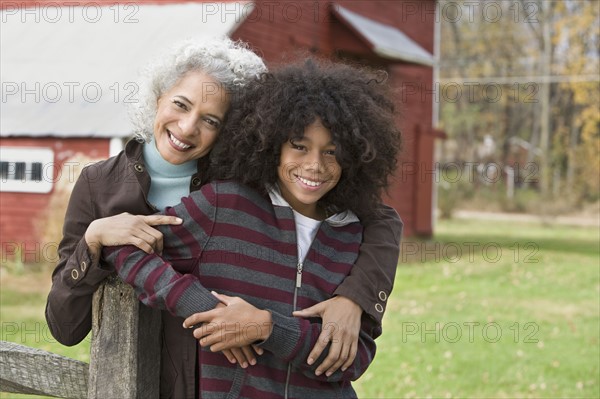 Woman embracing child. Photographer: Pauline St.Denis