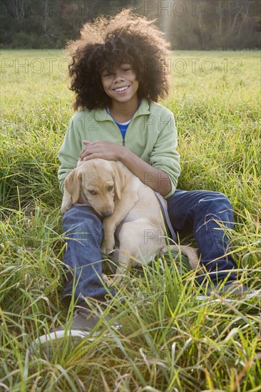 Child and dog. Photographer: Pauline St.Denis