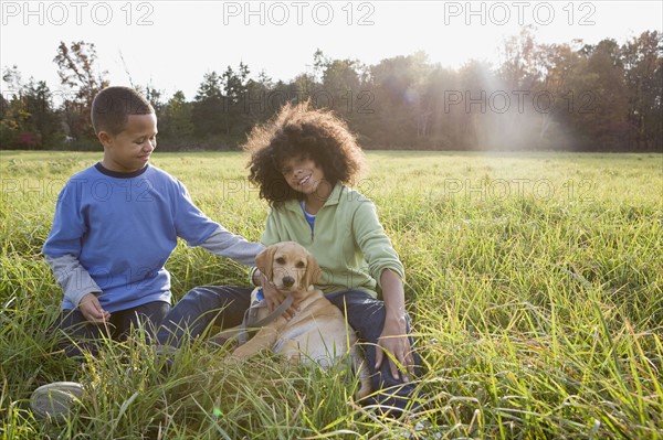 Children and dog. Photographer: Pauline St.Denis