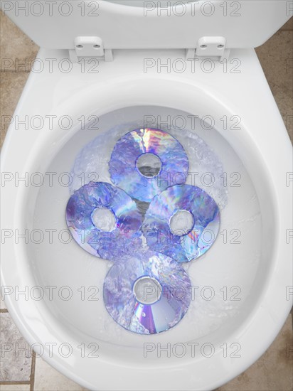 CD's in a toilet bowl. Photographer: Mike Kemp