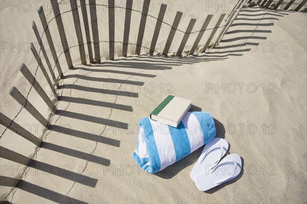 Fence on the beach. Photographer: Chris Hackett