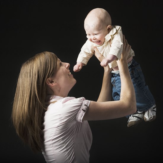 Woman holding baby. Photographer: Mike Kemp