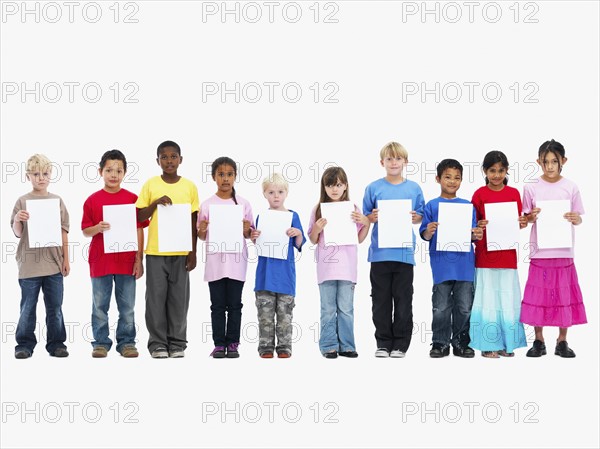 Children holding paper. Photographer: momentimages