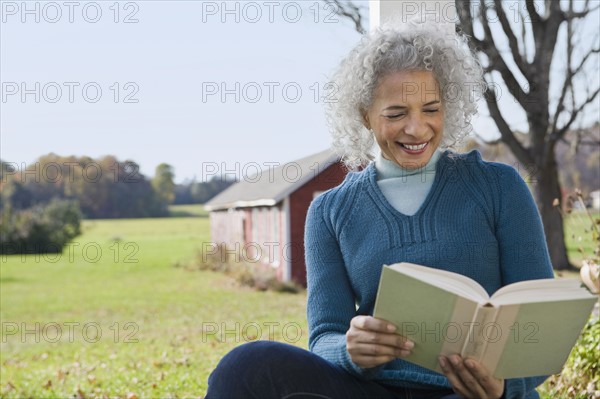 Woman reading a book. Photographer: Pauline St.Denis