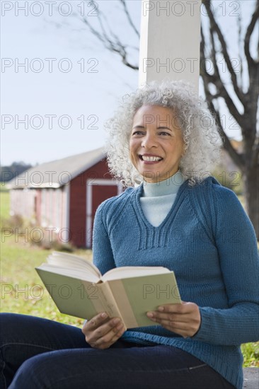 Woman reading a book. Photographer: Pauline St.Denis