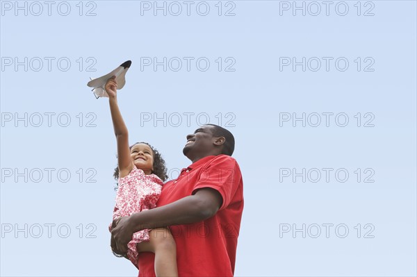 Child playing with toy plane. Photographer: Pauline St.Denis