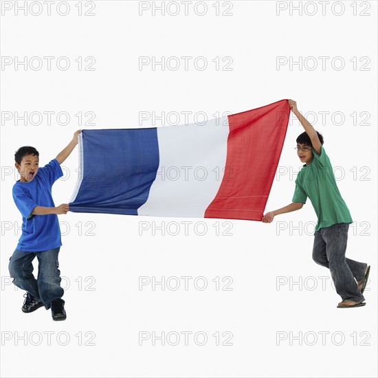 Children carrying flag. Photographer: momentimages