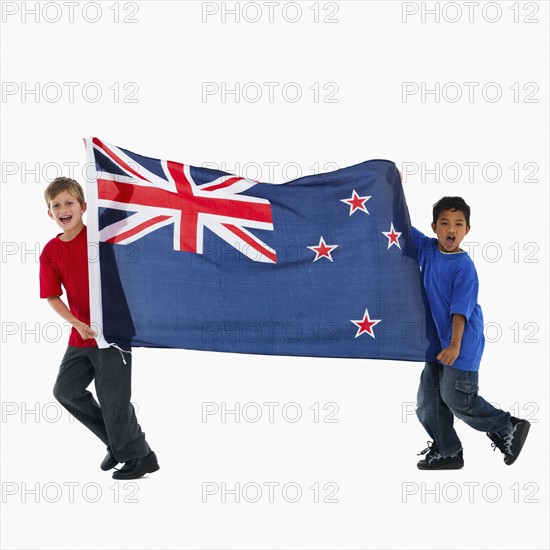 Children carrying flag. Photographer: momentimages