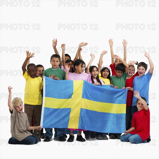 Children holding flag. Photographer: momentimages