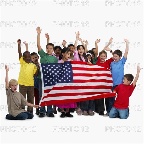 Children holding flag. Photographer: momentimages