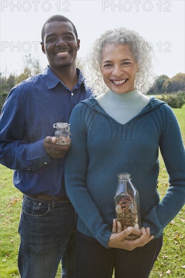 Couple holding jars. Photographer: Pauline St.Denis