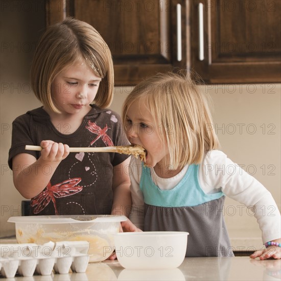 Tasting the batter. Photographer: Mike Kemp