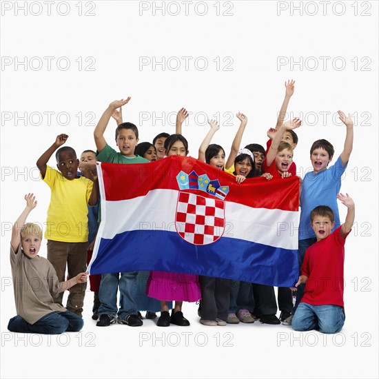 Children holding flag. Photographer: momentimages