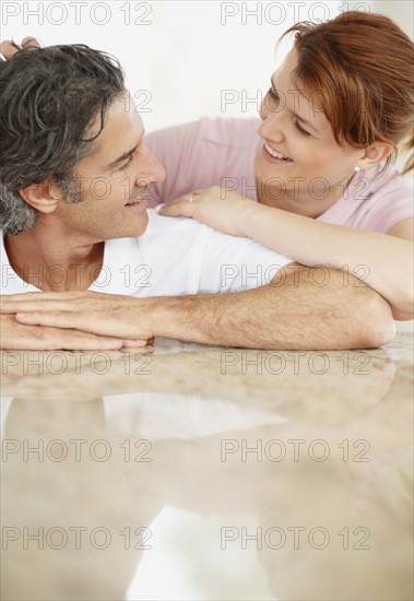 Man and woman talking. Photographer: momentimages