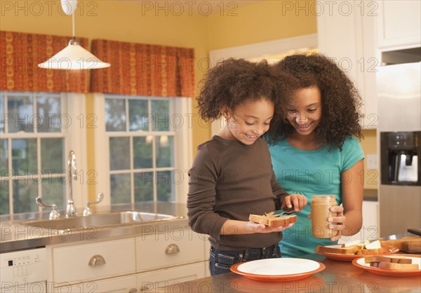 Making peanut butter sandwiches. Photographer: mark edward atkinson