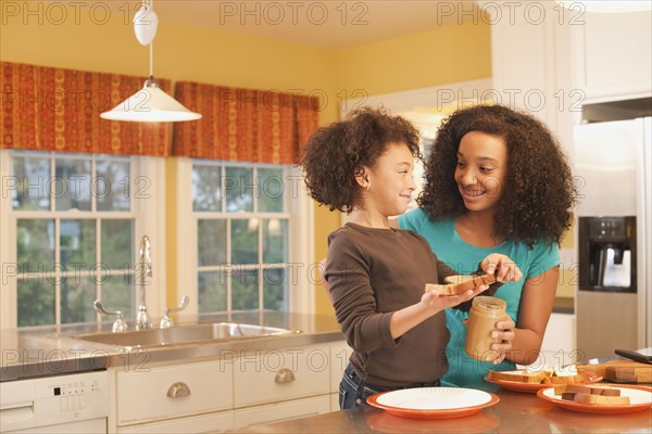 Making peanut butter sandwiches. Photographer: mark edward atkinson