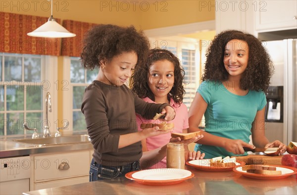 Making peanut butter sandwiches. Photographer: mark edward atkinson