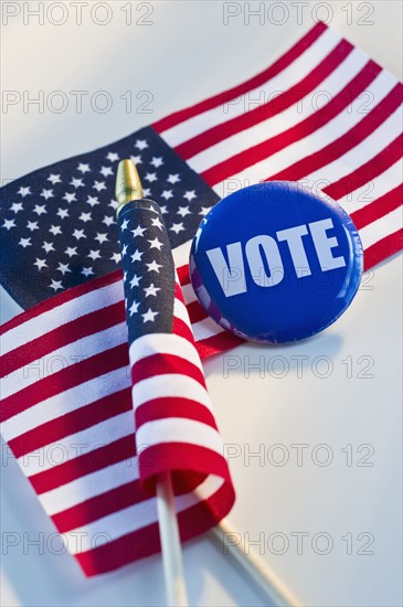 Election pin and American flags.