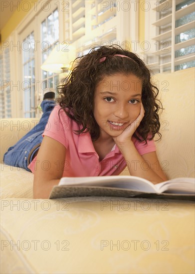 Young girl on couch. Photographer: mark edward atkinson