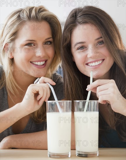 Friends drinking milk. Photographer: Jamie Grill