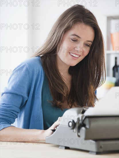 Woman typing. Photographer: Jamie Grill