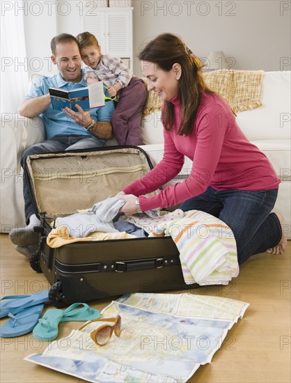 Packing for family vacation. Photographer: Jamie Grill