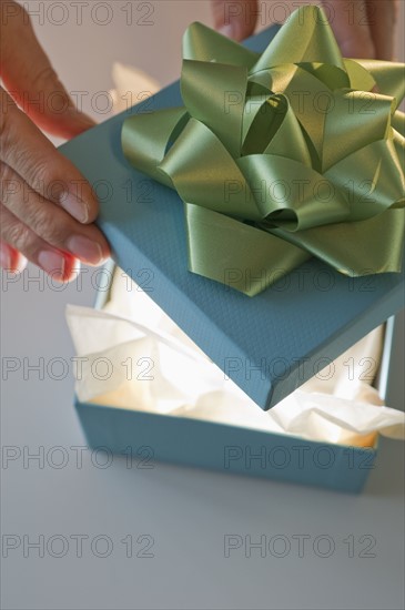 Opening a gift.