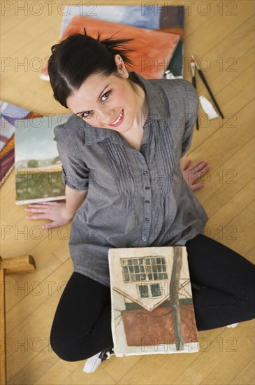 Artist and canvass painting. Photographer: Daniel Grill