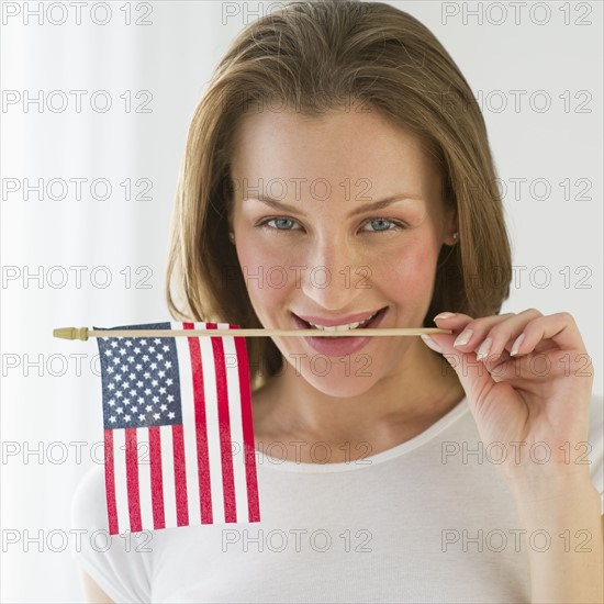 Woman holding American flag.