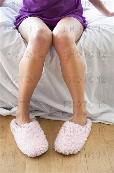 Woman wearing slippers.