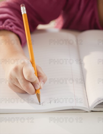 Young girl doing math homework. Photographer: Jamie Grill