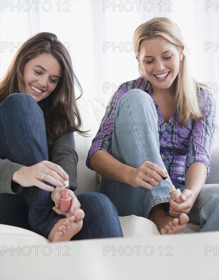 Painting toenails. Photographer: Jamie Grill