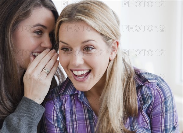 Sharing a secret. Photographer: Jamie Grill