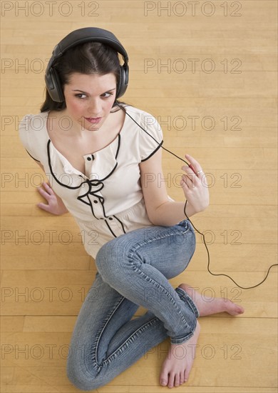 Woman wearing headphones. Photographer: Daniel Grill