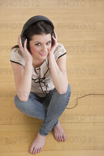 Woman wearing headphones. Photographer: Daniel Grill