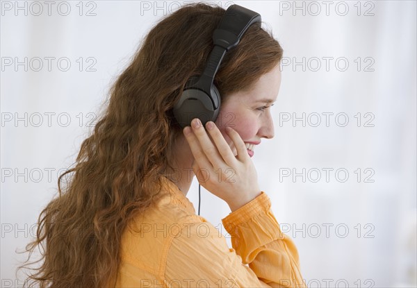 Woman wearing headphones.