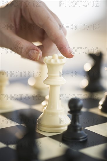 Playing game of chess.