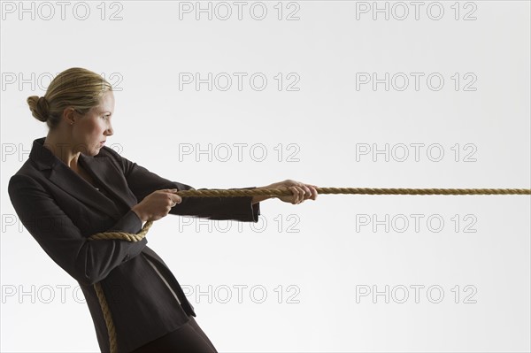 Woman pulling a rope.