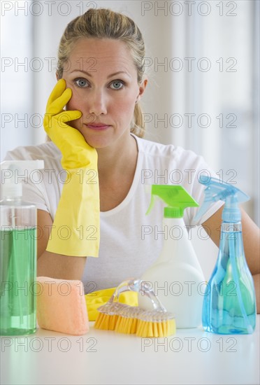 Woman and cleaning supplies.