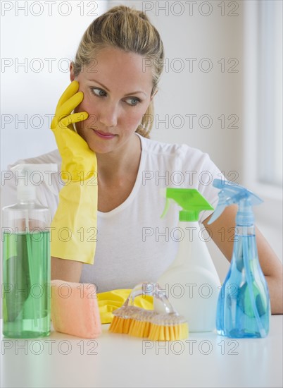Woman and cleaning supplies.