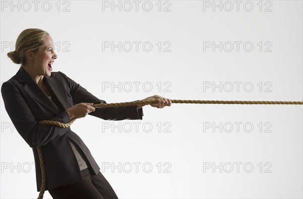 Woman pulling a rope.