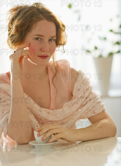 Beautiful woman drinking espresso.