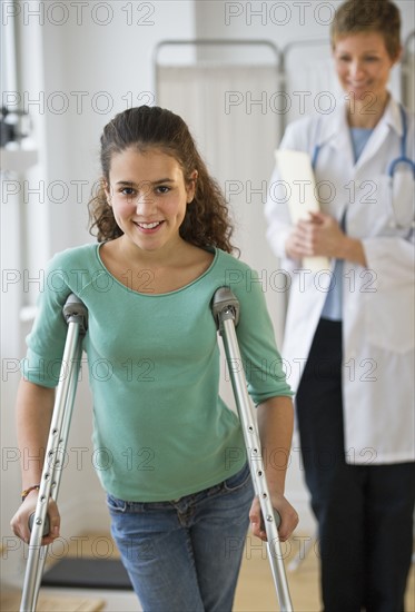 Patient walking on crutches.