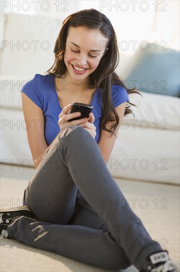 Teenage girl texting.