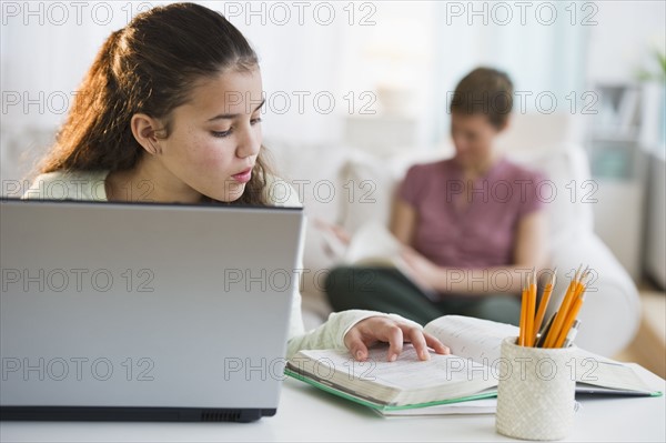 Young girl doing homework.