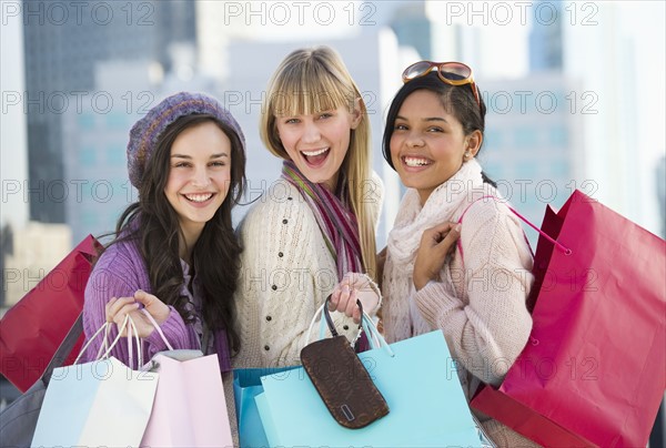 Young women with shopping bags.