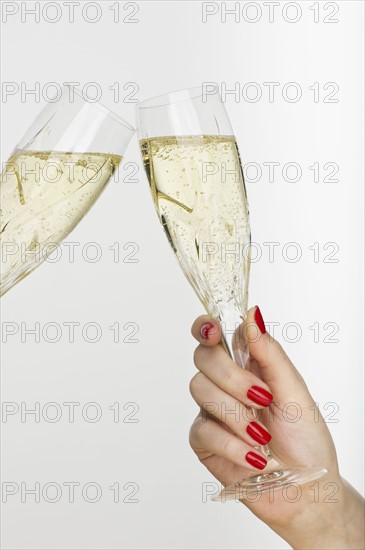 Hand holding champagne glass.