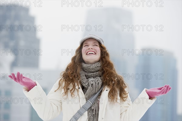 Woman enjoying a snowy day.