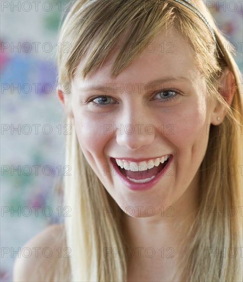 Young woman laughing.