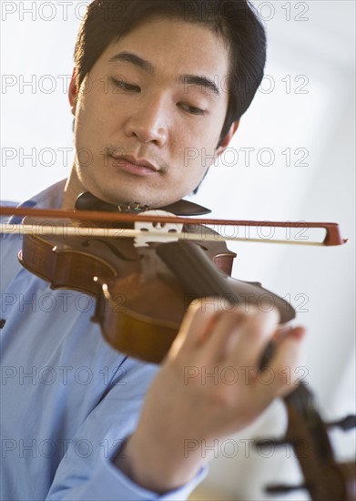 Man playing a violin.